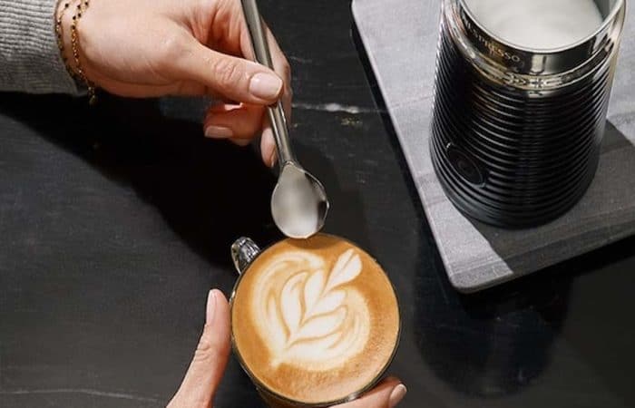 Nespresso machine and coffee cup